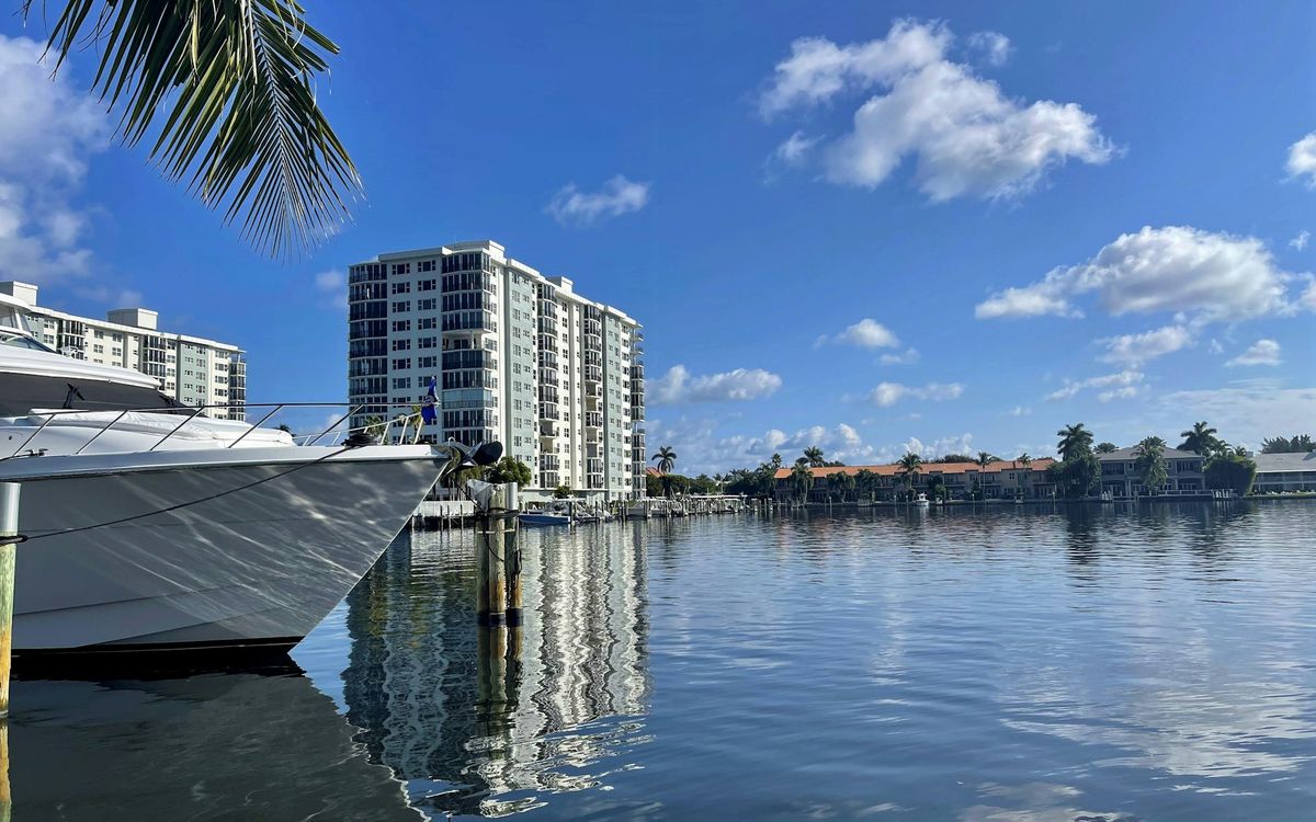 A boat moored on the Intracoastal beside Delray Beach buildings
