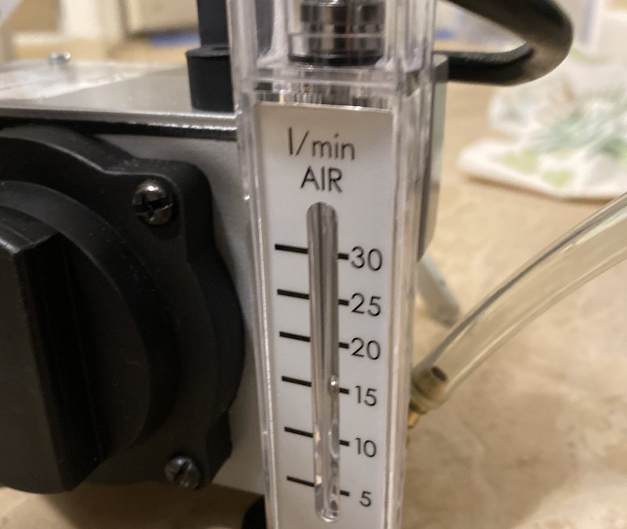 Calibrated air sampling pump with its flow meter set during a mold inspection.