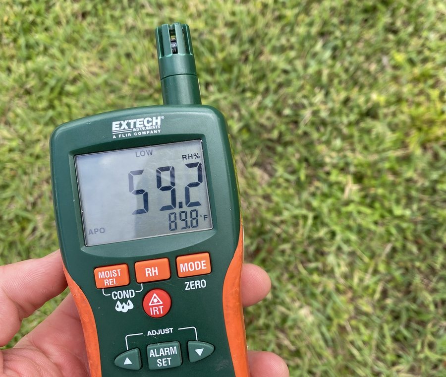 Handheld thermo-hygrometer reading 59.2 percent relative humidity.