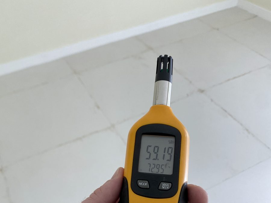 Digital hygrometer displaying relative humidity and temperature on site